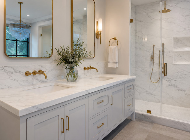 Bathroom vanity with Calacatta quartzite top and warm neutral tile