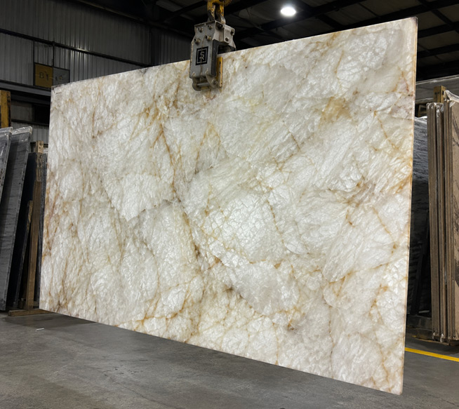 Designer comparing Cristallo quartzite slab options in Sacramento showroom